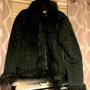 Leather cost.  Faux fur details
